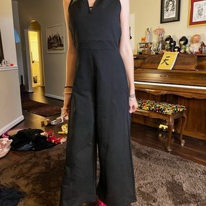 Cropped zip up black pantsuit.  Stretches and for fitting.